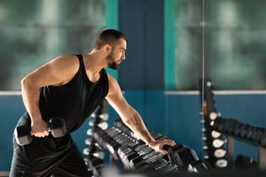 Athlete Doing Rows with Dumbbell